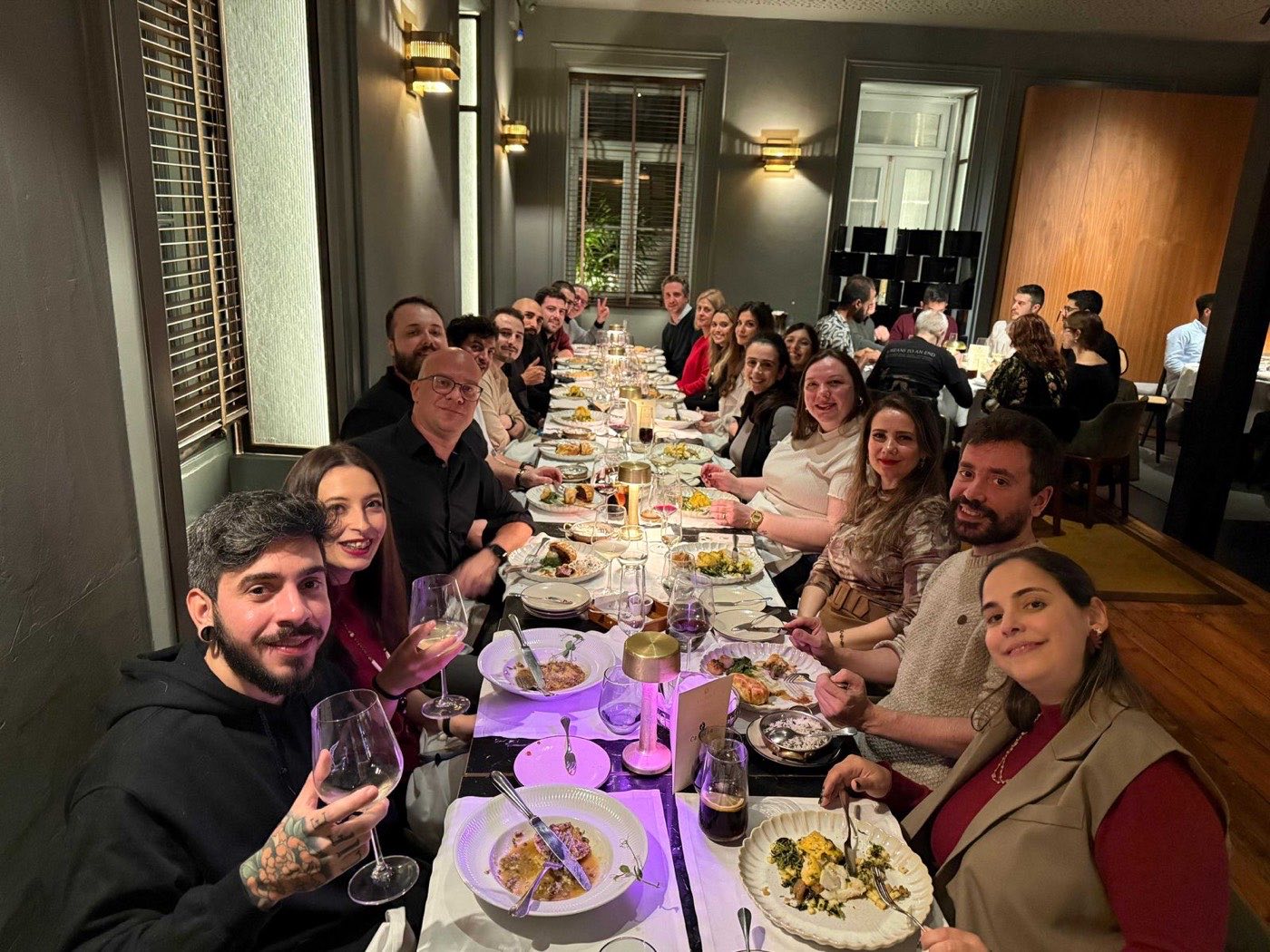 The team around a long table at the 2024 Christmas dinner