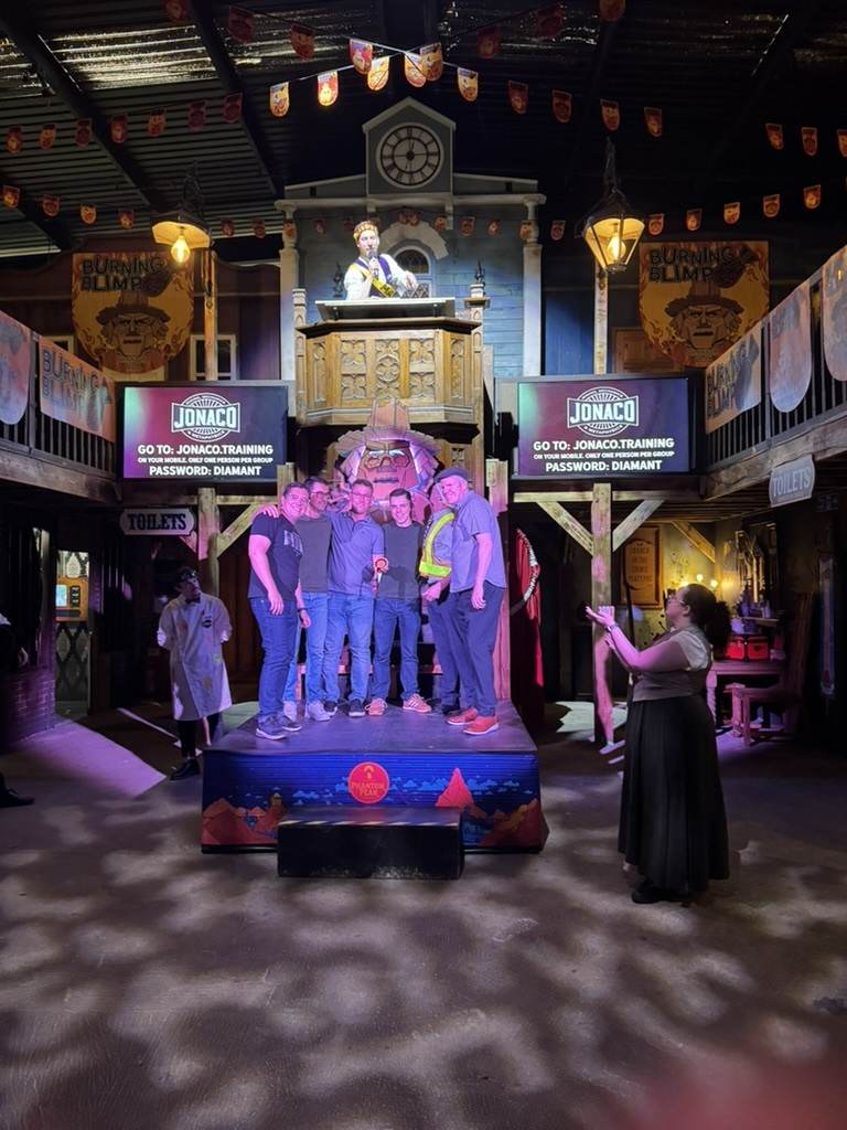 The team on stage at the 10th anniversary